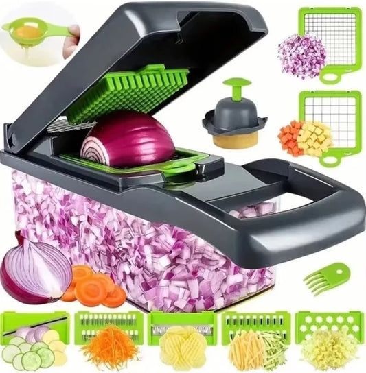 Vegetable chopper with its lid open over a halved red onion, with diced onion collected in the clear container below and several interchangeable cutting blades and an egg separator shown alongside